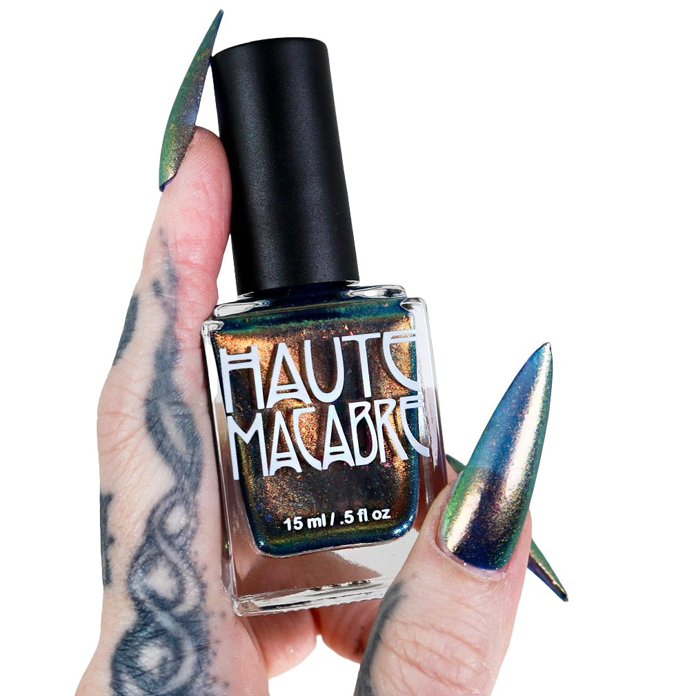 gothic hand holding vegan chrome nail polish